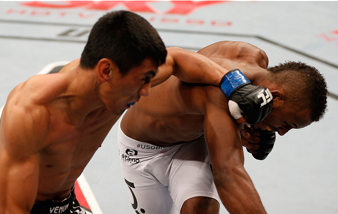 SAO PAULO, BRAZIL - MAY 31: (L-R) Mark Eddiva punches Kevin Souza in their featherweight fight during the UFC Fight Night event at the Ginasio do Ibirapuera on May 31, 2014 in Sao Paulo, Brazil. (Photo by Josh Hedges/Zuffa LLC/Zuffa LLC via Getty Images)