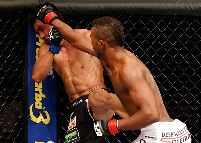 SAO PAULO, BRAZIL - MAY 31: (R-L) Kevin Souza punches Mark Eddiva in their featherweight fight during the UFC Fight Night event at the Ginasio do Ibirapuera on May 31, 2014 in Sao Paulo, Brazil. (Photo by Josh Hedges/Zuffa LLC/Zuffa LLC via Getty Images)