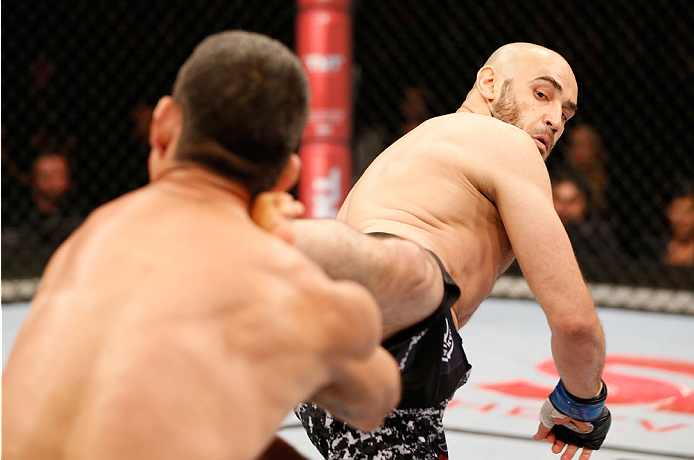 SAO PAULO, BRAZIL - MAY 31: (R-L) Gasan Umalatov kicks Paulo Thiago in their welterweight fight during the UFC Fight Night event at the Ginasio do Ibirapuera on May 31, 2014 in Sao Paulo, Brazil. (Photo by Josh Hedges/Zuffa LLC/Zuffa LLC via Getty Images