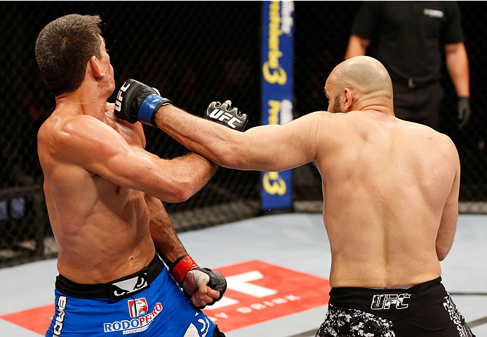 SAO PAULO, BRAZIL - MAY 31:  (R-L) Gasan Umalatov punches Paulo Thiago in their welterweight fight during the UFC Fight Night event at the Ginasio do Ibirapuera on May 31, 2014 in Sao Paulo, Brazil. (Photo by Josh Hedges/Zuffa LLC/Zuffa LLC via Getty Imag