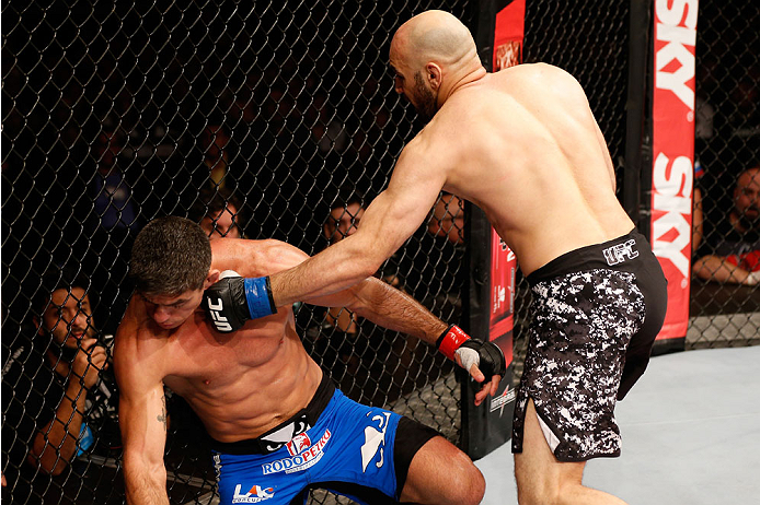 SAO PAULO, BRAZIL - MAY 31:  (R-L) Gasan Umalatov punches Paulo Thiago in their welterweight fight during the UFC Fight Night event at the Ginasio do Ibirapuera on May 31, 2014 in Sao Paulo, Brazil. (Photo by Josh Hedges/Zuffa LLC/Zuffa LLC via Getty Imag