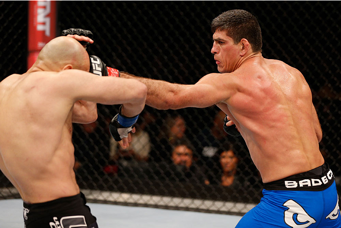 SAO PAULO, BRAZIL - MAY 31:  (R-L) Paulo Thiago punches Gasan Umalatov in their welterweight fight during the UFC Fight Night event at the Ginasio do Ibirapuera on May 31, 2014 in Sao Paulo, Brazil. (Photo by Josh Hedges/Zuffa LLC/Zuffa LLC via Getty Imag