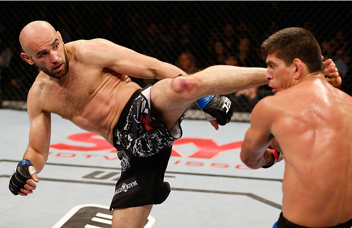 SAO PAULO, BRAZIL - MAY 31: (L-R) Gasan Umalatov kicks Paulo Thiago in their welterweight fight during the UFC Fight Night event at the Ginasio do Ibirapuera on May 31, 2014 in Sao Paulo, Brazil. (Photo by Josh Hedges/Zuffa LLC/Zuffa LLC via Getty Images