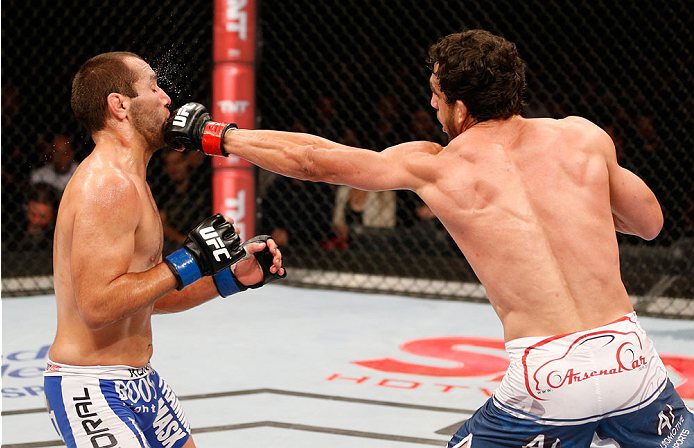 SAO PAULO, BRAZIL - MAY 31: (R-L) Elias Silverio punches Ernest Chavez in their lightweight fight during the UFC Fight Night event at the Ginasio do Ibirapuera on May 31, 2014 in Sao Paulo, Brazil. (Photo by Josh Hedges/Zuffa LLC/Zuffa LLC via Getty Image