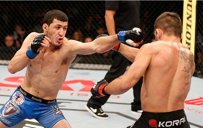 SAO PAULO, BRAZIL - MAY 31: (L-R) Rashid Magomedov punches Rodrigo Damm in their lightweight fight during the UFC Fight Night event at the Ginasio do Ibirapuera on May 31, 2014 in Sao Paulo, Brazil. (Photo by Josh Hedges/Zuffa LLC/Zuffa LLC via Getty Imag