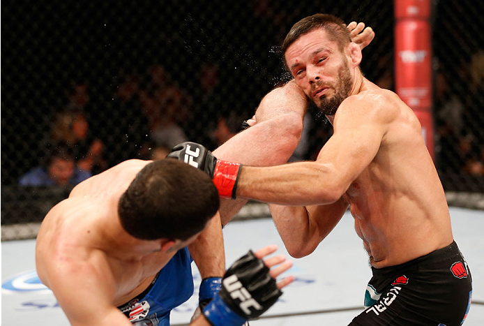 SAO PAULO, BRAZIL - MAY 31: (L-R) Rashid Magomedov kicks Rodrigo Damm in their lightweight fight during the UFC Fight Night event at the Ginasio do Ibirapuera on May 31, 2014 in Sao Paulo, Brazil. (Photo by Josh Hedges/Zuffa LLC/Zuffa LLC via Getty Images