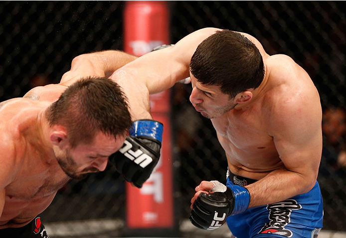 SAO PAULO, BRAZIL - MAY 31: (R-L) Rashid Magomedov punches Rodrigo Damm in their lightweight fight during the UFC Fight Night event at the Ginasio do Ibirapuera on May 31, 2014 in Sao Paulo, Brazil. (Photo by Josh Hedges/Zuffa LLC/Zuffa LLC via Getty Imag