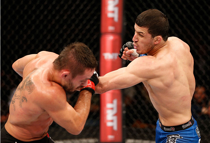 SAO PAULO, BRAZIL - MAY 31: (R-L) Rashid Magomedov punches Rodrigo Damm in their lightweight fight during the UFC Fight Night event at the Ginasio do Ibirapuera on May 31, 2014 in Sao Paulo, Brazil. (Photo by Josh Hedges/Zuffa LLC/Zuffa LLC via Getty Imag