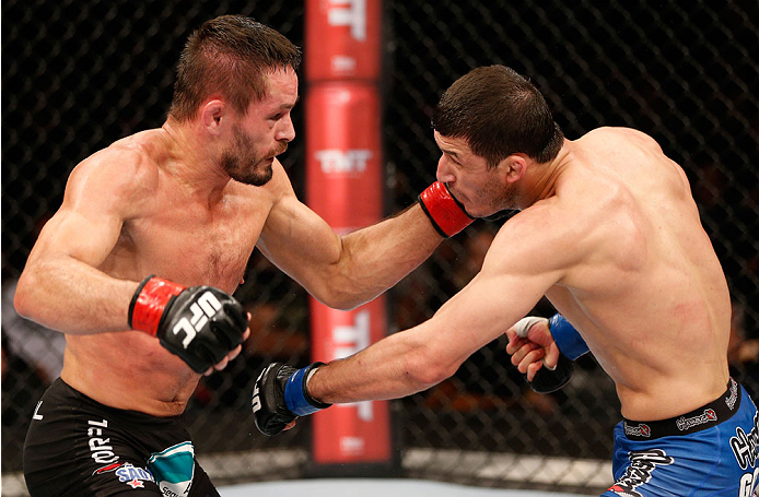 SAO PAULO, BRAZIL - MAY 31: (L-R) \rd punches Rashid Magomedov in their lightweight fight during the UFC Fight Night event at the Ginasio do Ibirapuera on May 31, 2014 in Sao Paulo, Brazil. (Photo by Josh Hedges/Zuffa LLC/Zuffa LLC via Getty Images)