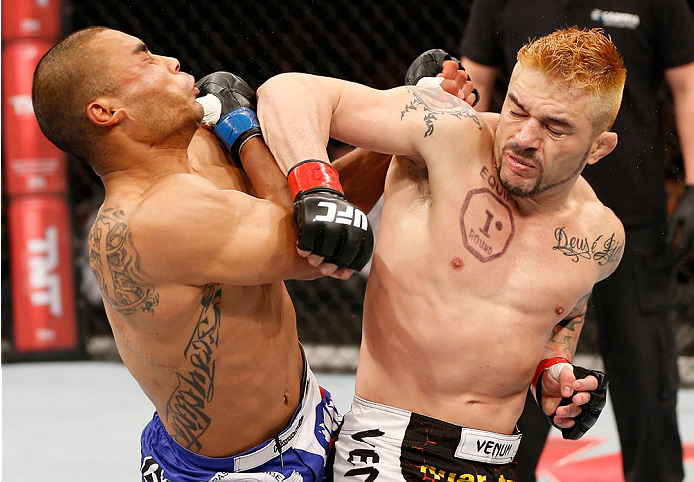 SAO PAULO, BRAZIL - MAY 31: (R-L) Rony "Jason" Mariano-Bazzera lands a spinning back elbow against Robbie Peralta in their featherweight fight during the UFC Fight Night event at the Ginasio do Ibirapuera on May 31, 2014 in Sao Paulo, Brazil. (Photo by Jo