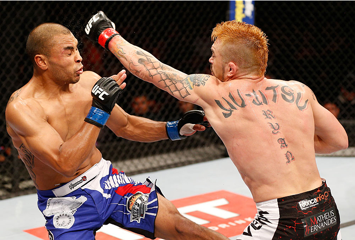 SAO PAULO, BRAZIL - MAY 31: (R-L) Rony "Jason" Mariano-Bazzera punches Robbie Peralta in their featherweight fight during the UFC Fight Night event at the Ginasio do Ibirapuera on May 31, 2014 in Sao Paulo, Brazil. (Photo by Josh Hedges/Zuffa LLC/Zuffa LL