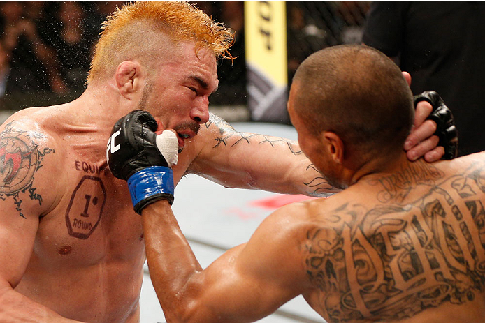 SAO PAULO, BRAZIL - MAY 31: (R-L) Robbie Peralta punches Rony "Jason" Mariano-Bazzera in their featherweight fight during the UFC Fight Night event at the Ginasio do Ibirapuera on May 31, 2014 in Sao Paulo, Brazil. (Photo by Josh Hedges/Zuffa LLC/Zuffa LL