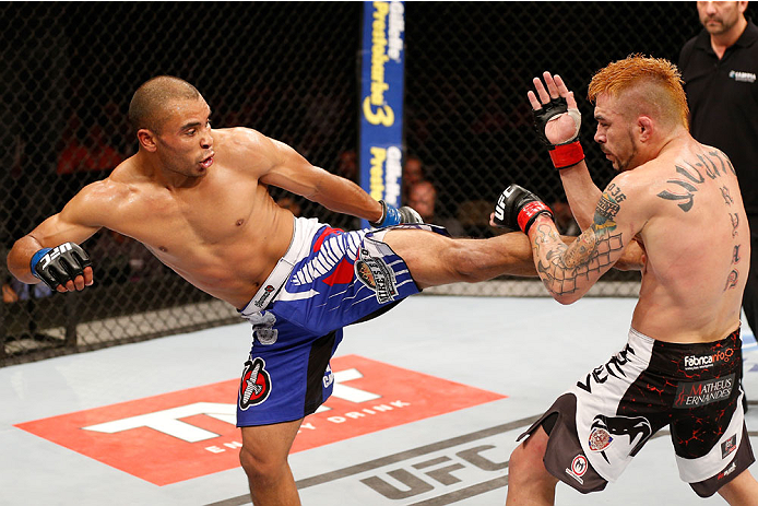 SAO PAULO, BRAZIL - MAY 31: (L-R) Robbie Peralta kicks Rony "Jason" Mariano-Bazzera in their featherweight fight during the UFC Fight Night event at the Ginasio do Ibirapuera on May 31, 2014 in Sao Paulo, Brazil. (Photo by Josh Hedges/Zuffa LLC/Zuffa LLC