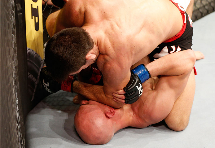 SAO PAULO, BRAZIL - MAY 31: Demian Maia (top) elbows Alexander Yakovlev in their welterweight fight during the UFC Fight Night event at the Ginasio do Ibirapuera on May 31, 2014 in Sao Paulo, Brazil. (Photo by Josh Hedges/Zuffa LLC/Zuffa LLC via Getty Ima