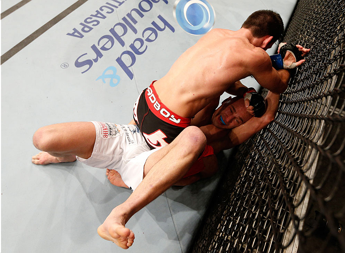 SAO PAULO, BRAZIL - MAY 31: Demian Maia (top) punches Alexander Yakovlev in their welterweight fight during the UFC Fight Night event at the Ginasio do Ibirapuera on May 31, 2014 in Sao Paulo, Brazil. (Photo by Josh Hedges/Zuffa LLC/Zuffa LLC via Getty Im