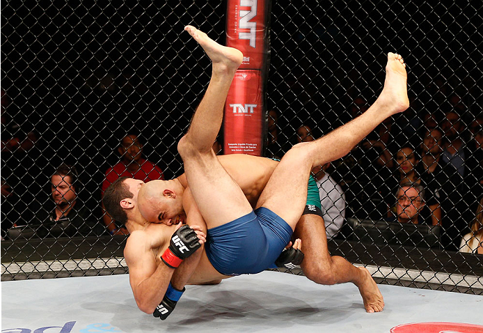 SAO PAULO, BRAZIL - MAY 31:  (R-L) Warlley Alves takes down Marcio Alexandre in their middleweight fight during the UFC Fight Night event at the Ginasio do Ibirapuera on May 31, 2014 in Sao Paulo, Brazil. (Photo by Josh Hedges/Zuffa LLC/Zuffa LLC via Gett