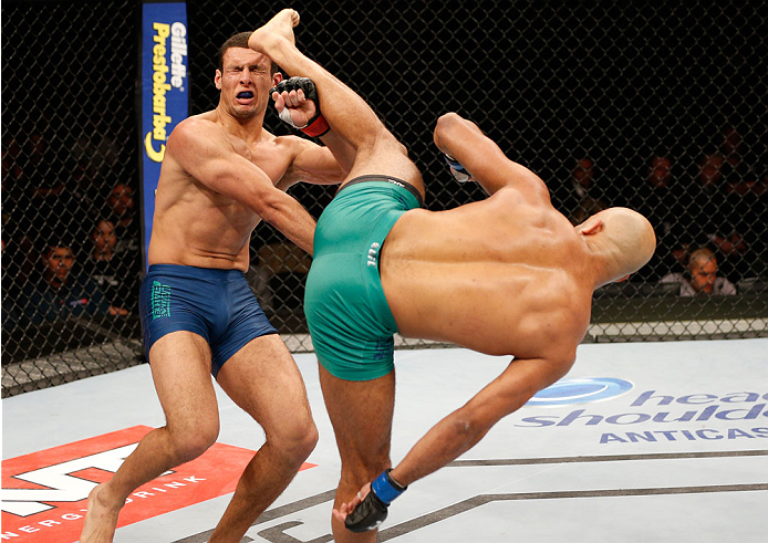 SAO PAULO, BRAZIL - MAY 31:  (R-L) Warlley Alves kicks Marcio Alexandre in their middleweight fight during the UFC Fight Night event at the Ginasio do Ibirapuera on May 31, 2014 in Sao Paulo, Brazil. (Photo by Josh Hedges/Zuffa LLC/Zuffa LLC via Getty Ima