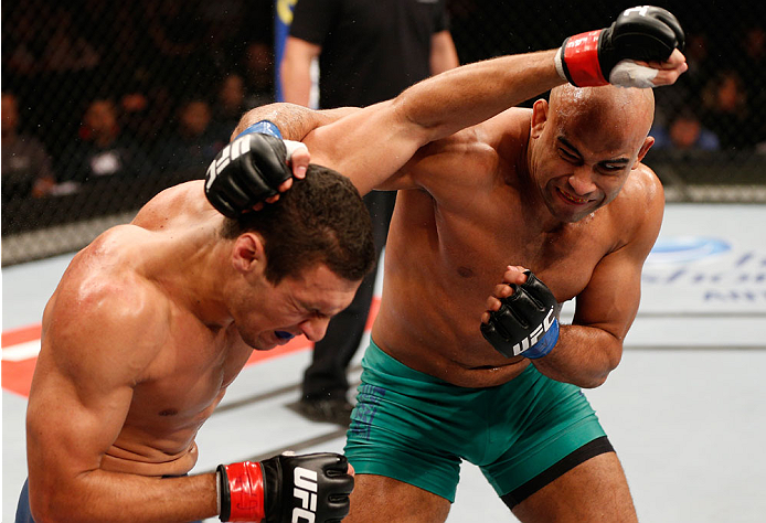 SAO PAULO, BRAZIL - MAY 31:  (R-L) Warlley Alves punches Marcio Alexandre in their middleweight fight during the UFC Fight Night event at the Ginasio do Ibirapuera on May 31, 2014 in Sao Paulo, Brazil. (Photo by Josh Hedges/Zuffa LLC/Zuffa LLC via Getty I