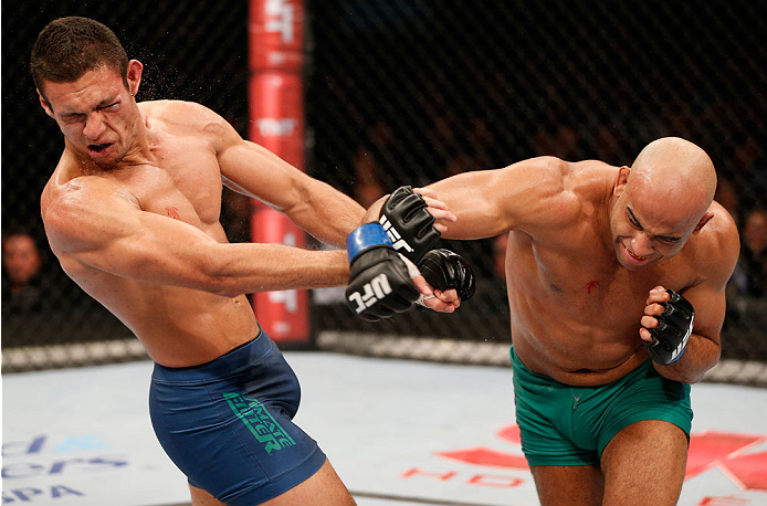 SAO PAULO, BRAZIL - MAY 31:  (R-L) Warlley Alves punches Marcio Alexandre in their middleweight fight during the UFC Fight Night event at the Ginasio do Ibirapuera on May 31, 2014 in Sao Paulo, Brazil. (Photo by Josh Hedges/Zuffa LLC/Zuffa LLC via Getty I