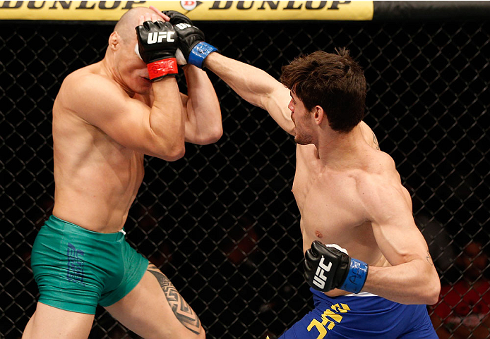 SAO PAULO, BRAZIL - MAY 31:  (R-L) Antonio Carlos Junior punches Vitor Miranda in their heavyweight fight during the UFC Fight Night event at the Ginasio do Ibirapuera on May 31, 2014 in Sao Paulo, Brazil. (Photo by Josh Hedges/Zuffa LLC/Zuffa LLC via Get