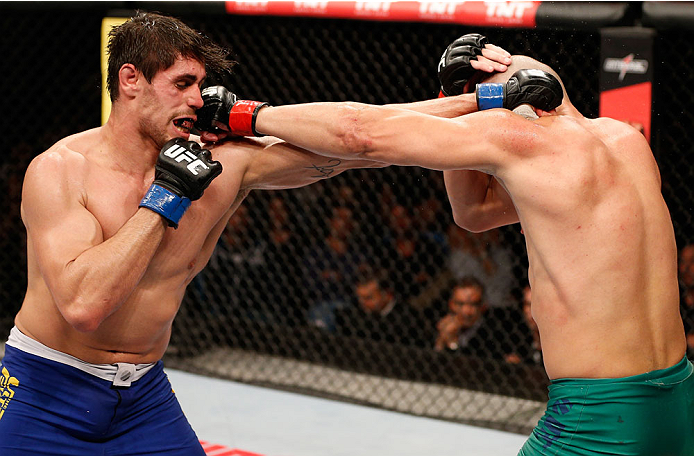 SAO PAULO, BRAZIL - MAY 31:  (L-R) Antonio Carlos Junior and Vitor Miranda trade punches in their heavyweight fight during the UFC Fight Night event at the Ginasio do Ibirapuera on May 31, 2014 in Sao Paulo, Brazil. (Photo by Josh Hedges/Zuffa LLC/Zuffa L