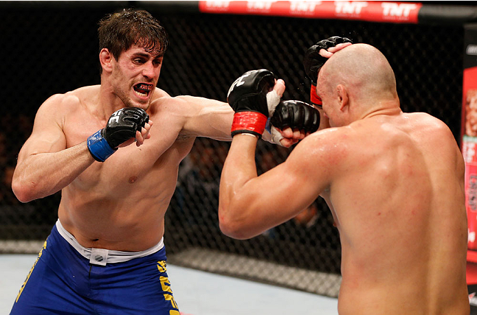 SAO PAULO, BRAZIL - MAY 31:  (L-R) Antonio Carlos Junior punches Vitor Miranda in their heavyweight fight during the UFC Fight Night event at the Ginasio do Ibirapuera on May 31, 2014 in Sao Paulo, Brazil. (Photo by Josh Hedges/Zuffa LLC/Zuffa LLC via Get