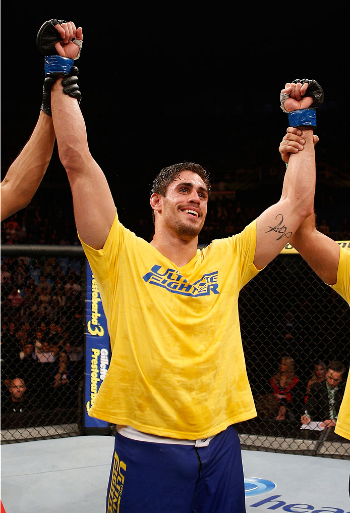 SAO PAULO, BRAZIL - MAY 31: Antonio Carlos Junior celebrates after his unanimous decision victory over Vitor Miranda in their heavyweight fight during the UFC Fight Night event at the Ginasio do Ibirapuera on May 31, 2014 in Sao Paulo, Brazil. (Photo by