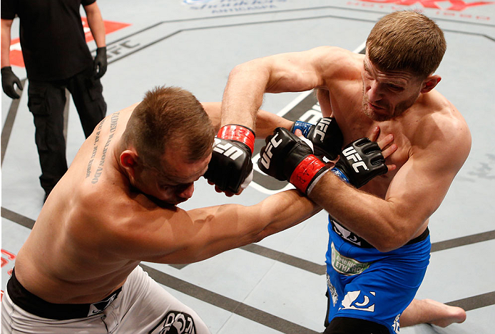 SAO PAULO, BRAZIL - MAY 31: (R-L) Stipe Miocic knocks out Fabio Maldonado in their heavyweight fight during the UFC Fight Night event at the Ginasio do Ibirapuera on May 31, 2014 in Sao Paulo, Brazil. (Photo by Josh Hedges/Zuffa LLC/Zuffa LLC via Getty I