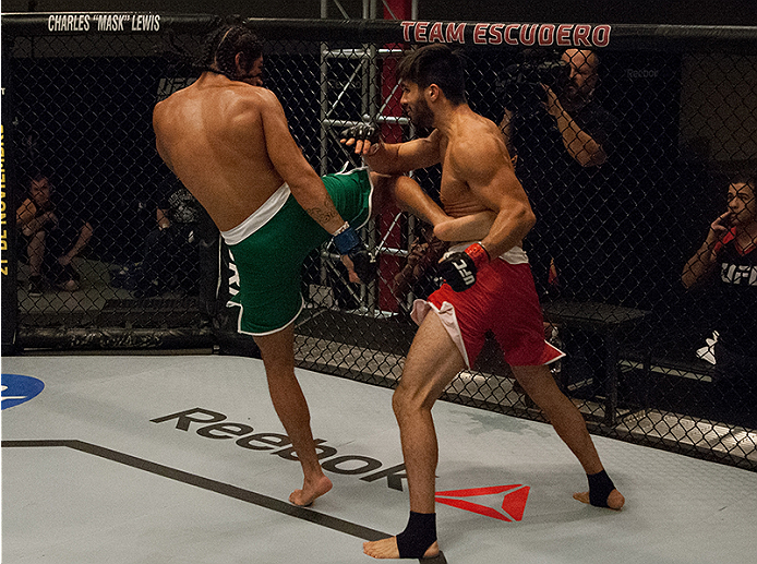 LAS VEGAS, NV - MARCH 27:  (L-R) Danny Salas kicks Horacio Gutierrez during the filming of The Ultimate Fighter Latin America: Team Gastelum vs Team Escudero  on March 27, 2015 in Las Vegas, Nevada. (Photo by Brandon Magnus/Zuffa LLC/Zuffa LLC via Getty I