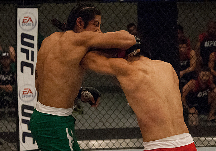 LAS VEGAS, NV - MARCH 27: (L-R) Danny Salas exchanges elbows with Horacio Gutierrez during the filming of The Ultimate Fighter Latin America: Team Gastelum vs Team Escudero on March 27, 2015 in Las Vegas, Nevada. (Photo by Brandon Magnus/Zuffa LLC/Zuffa