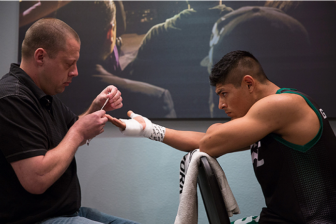 LAS VEGAS, NV - APRIL 10: Hector Aldana gets his hands wrapped before facing Alvaro Herrera during the filming of The Ultimate Fighter Latin America: Team Gastelum vs Team Escudero on April 10, 2015 in Las Vegas, Nevada. (Photo by Brandon Magnus/Zuffa L