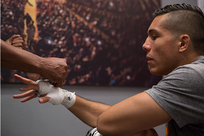 LAS VEGAS, NV - APRIL 10: Alvaro Herrera gets his hands wrapped before facing Hector Aldana during the filming of The Ultimate Fighter Latin America: Team Gastelum vs Team Escudero on April 10, 2015 in Las Vegas, Nevada. (Photo by Brandon Magnus/Zuffa L