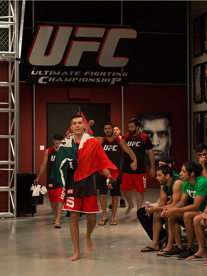 LAS VEGAS, NV - APRIL 10: Alvaro Herrera prepares to enter the Octagon before facing Hector Aldana during the filming of The Ultimate Fighter Latin America: Team Gastelum vs Team Escudero on April 10, 2015 in Las Vegas, Nevada. (Photo by Brandon Magnus/