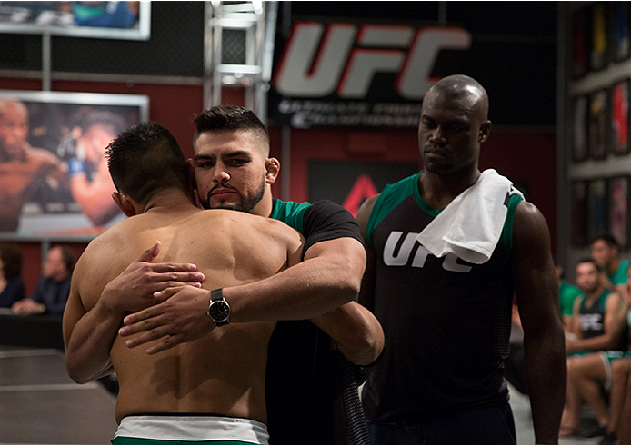 LAS VEGAS, NV - APRIL 10: Hector Aldana hugs his head coach Kelvin Gastelum before entering the Octagon before facing Alvaro Herrera during the filming of The Ultimate Fighter Latin America: Team Gastelum vs Team Escudero on April 10, 2015 in Las Vegas,