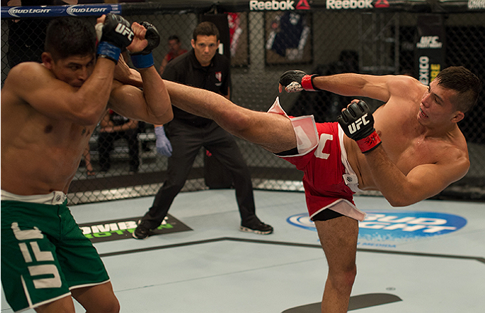 LAS VEGAS, NV - APRIL 10: (R-L) Alvaro Herrera kicks Hector Aldana during the filming of The Ultimate Fighter Latin America: Team Gastelum vs Team Escudero on April 10, 2015 in Las Vegas, Nevada. (Photo by Brandon Magnus/Zuffa LLC/Zuffa LLC via Getty Im