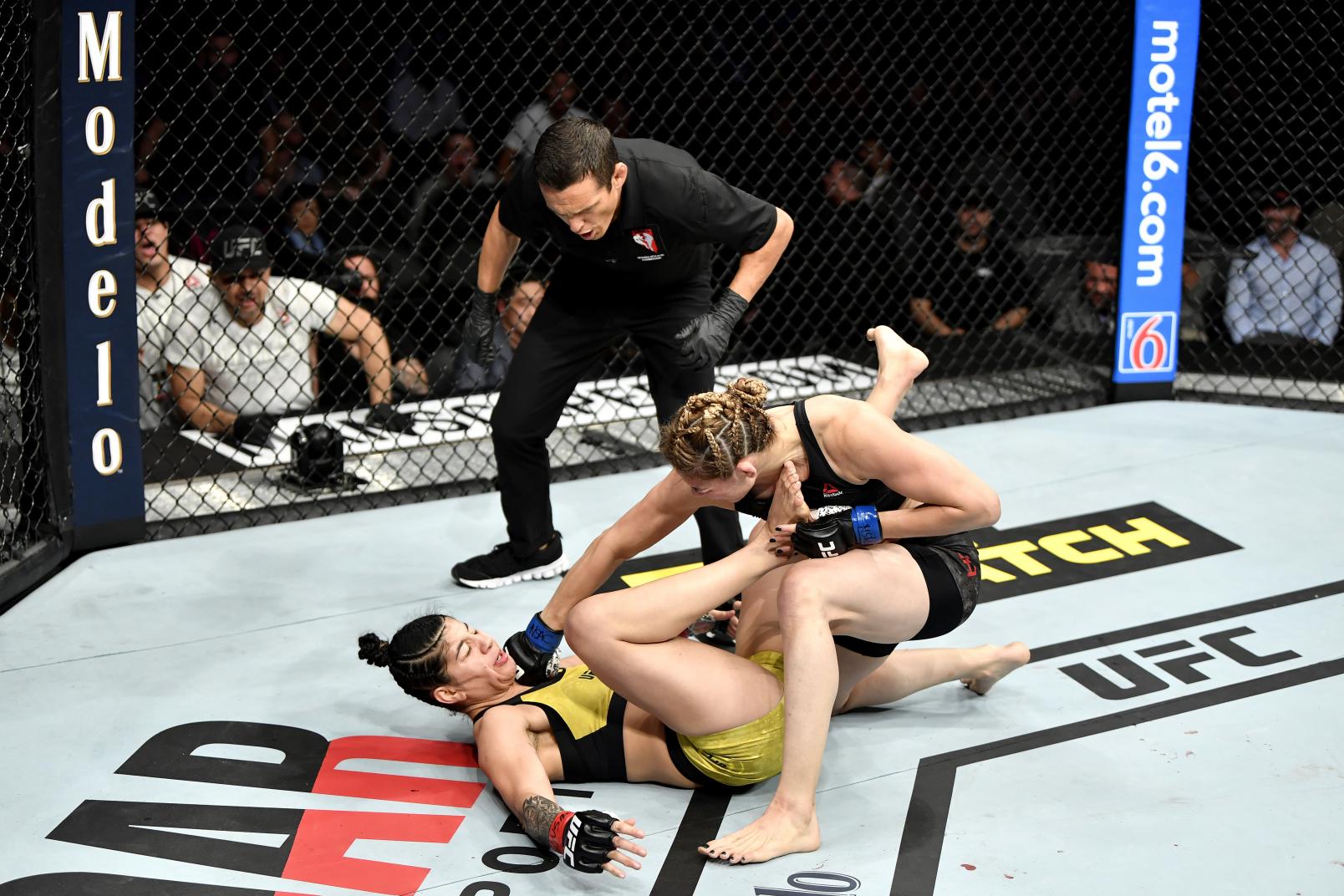 Irene Aldana of Mexico strikes Ketlen Vieira of Brazil in their women's bantamweight bout during the UFC 245.