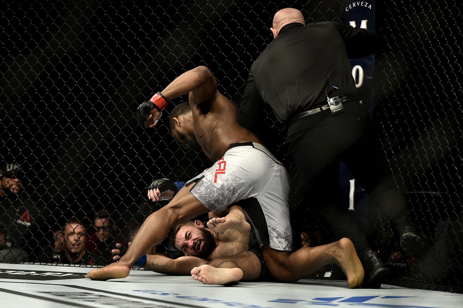 Geoff Neal punches Mike Perry in their welterweight bout during the UFC 245.