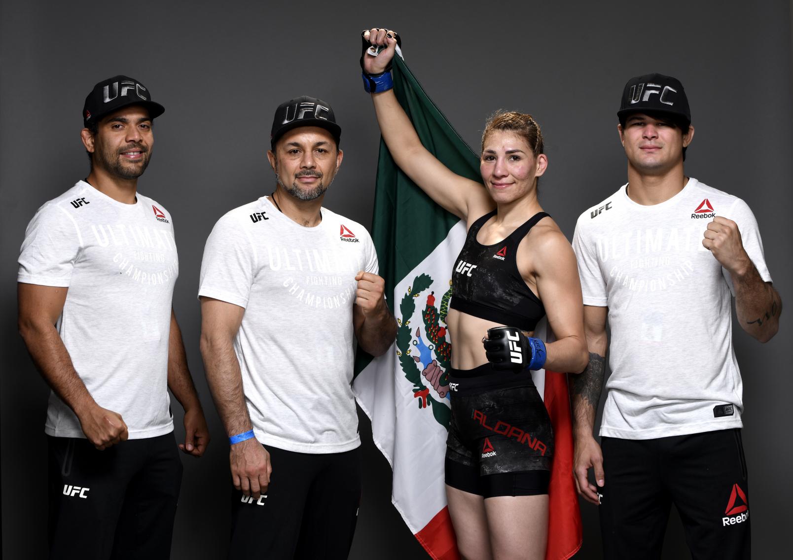Irene Aldana of Mexico and team pose for a portrait during the UFC 245.