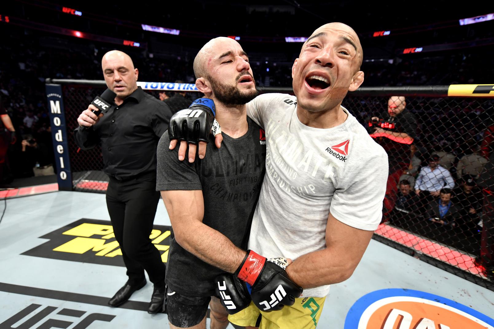 Marlon Moraes of Brazil and Jose Aldo of Brazil talk after their bantamweight bout during the UFC 245