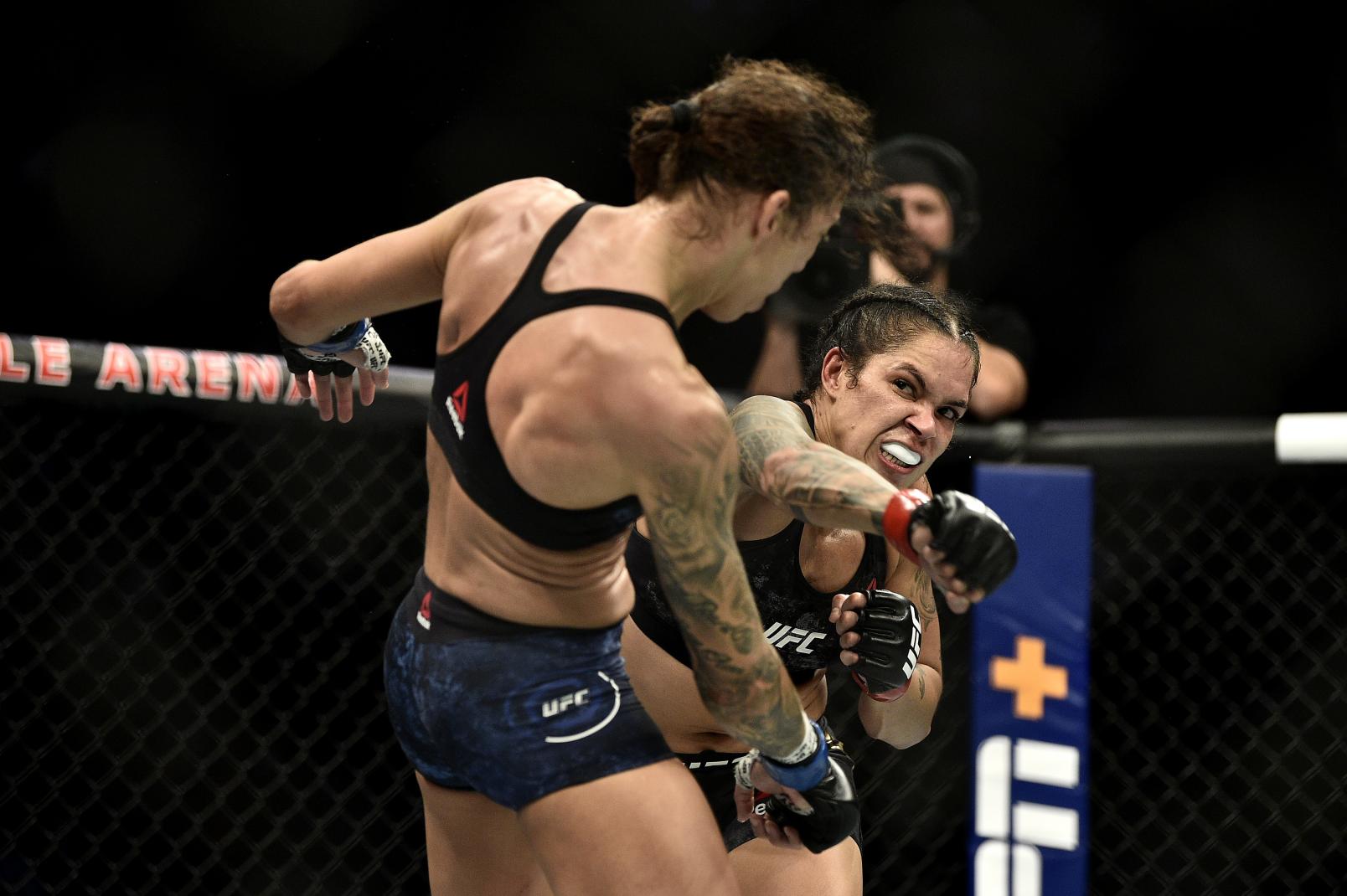 Amanda Nunes of Brazil strikes Germaine de Randamie of Netherlands in their UFC women's bantamweight championship bout during the UFC 245