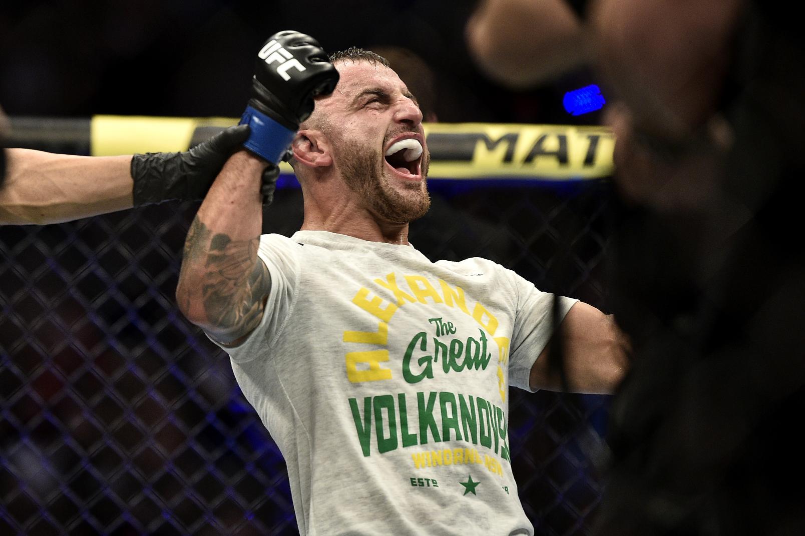Alexander Volkanovski of Australia celebrates his win in the octagon during the UFC 245