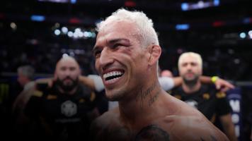 PHOENIX, ARIZONA - MAY 07: Charles Oliveira of Brazil reacts after his submission victory over Justin Gaethje in the UFC lightweight championship fight during the UFC 274 event at Footprint Center on May 07, 2022 in Phoenix, Arizona. (Photo by Chris Unger/Zuffa LLC)