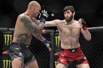 Magomed Ankalaev of Russia punches Anthony Smith in a light heavyweight fight during the UFC 277 event