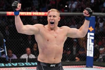 Sergei Pavlovich of Russia celebrates after defeating Derrick Lewis in a heavyweight fight during the UFC 277 event