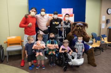 UFC athletes Brandon Moreno, Justin Gaethje, Jalin Turner, and Brendan Allen visit the Primary Children's Hospital in Salt Lake City, Utah. (Photo by Melissa Majchrzak via Primary Children's Hospital)