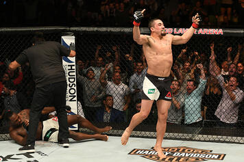 Robert Whittaker of New Zealand celebrates his TKO victory over Derek Brunson in their middleweight bout during the UFC Fight Night event at Rod Laver Arena on November 27, 2016 in Melbourne, Australia. (Photo by Jeff Bottari/Zuffa LLC)
