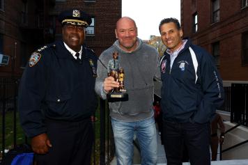 Police chief Jeffery Maddrey, UFC president Dana White and Chef's Choice President Pat Russo poses for a photo following their visit to NYC Cops and Kids Boxing Gym on November 03, 2021 in Brooklyn, New York. (Photo by Mike Stobe/Zuffa LLC)