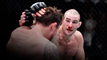 Sean Strickland punches Jack Hermansson of Sweden in their middleweight fight during the UFC Fight Night event at UFC APEX on February 05, 2022 in Las Vegas, Nevada. (Photo by Chris Unger/Zuffa LLC)