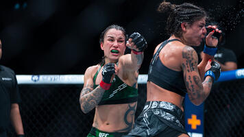 Raquel Pennington punches Mayra Bueno Silva of Brazil in a UFC bantamweight championship bout during the UFC 297 event at Scotiabank Arena on January 20, 2024 in Toronto, Ontario. (Photo by Nolan Walker/Zuffa LLC)