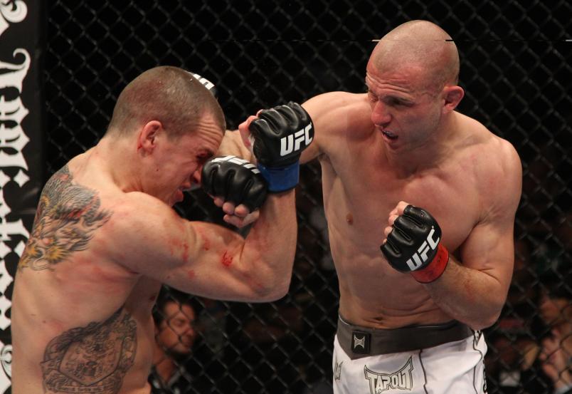 LAS VEGAS - FEBRUARY 05: (R-L) Donald "Cowboy" Cerrone punches Paul Kelly during their lightweight bout at UFC 126 at the Mandalay Bay Events Center on February 5, 2011 in Las Vegas, Nevada. (Photo by Jed Jacobsohn/Zuffa LLC/Zuffa LLC via Getty Images)
